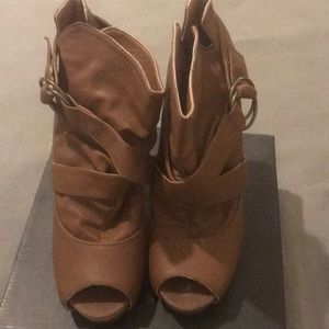 Heeled open toed boots